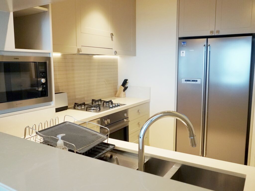 A kitchen with stainless steel appliances and a sink